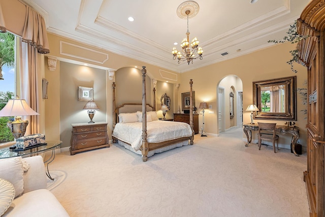 bedroom with carpet, a notable chandelier, ornamental molding, and a tray ceiling