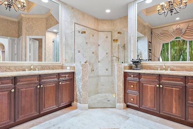 bathroom with a shower with door, vanity, and a chandelier