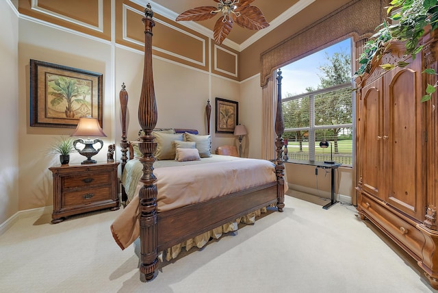 bedroom featuring ceiling fan, ornamental molding, and light carpet