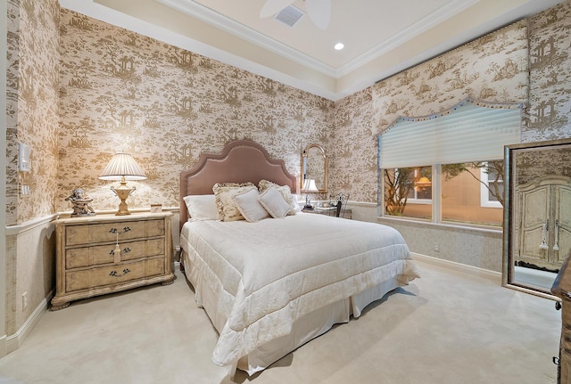 carpeted bedroom with ceiling fan and ornamental molding