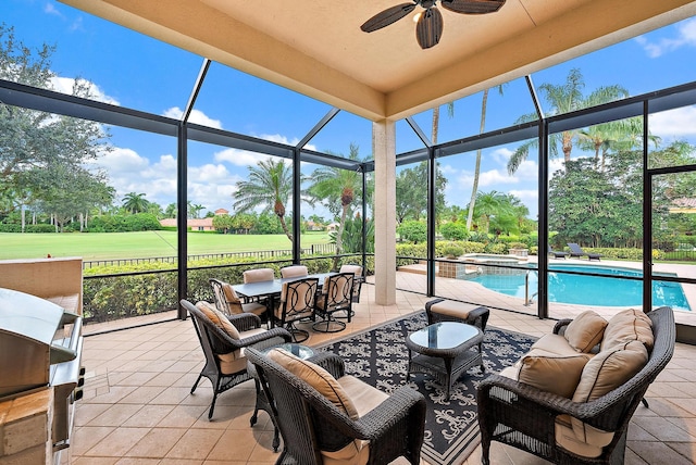 sunroom featuring ceiling fan and a healthy amount of sunlight