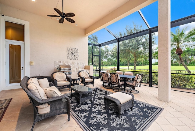 view of patio / terrace featuring ceiling fan and glass enclosure