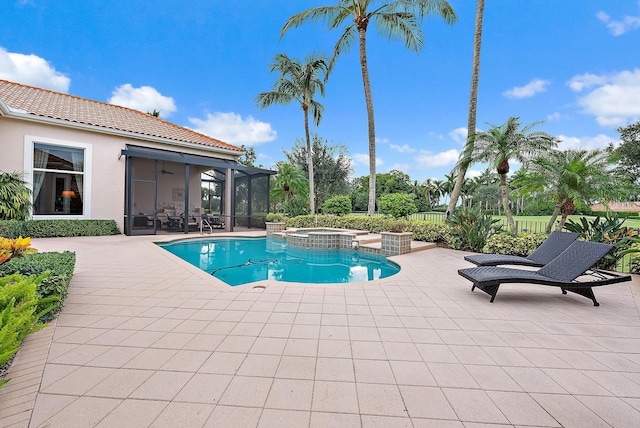 view of pool featuring an in ground hot tub and a patio