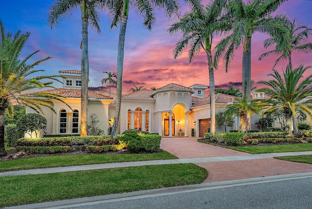 mediterranean / spanish-style home featuring a garage