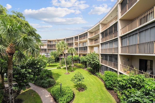 view of home's community with a lawn