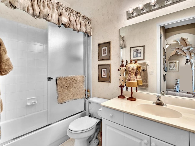 bathroom with tile patterned flooring, wallpapered walls, toilet, combined bath / shower with glass door, and vanity