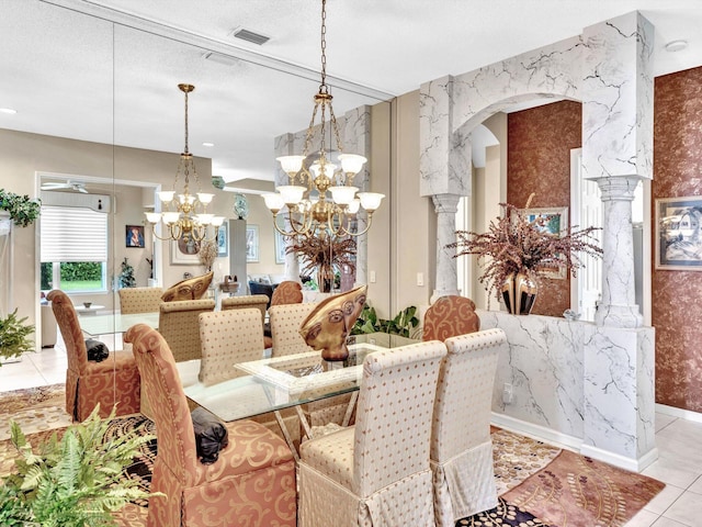 dining space with light tile patterned floors, visible vents, ornate columns, an inviting chandelier, and arched walkways