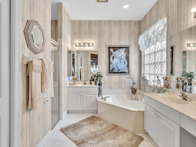 full bath featuring tile patterned flooring, a stall shower, wallpapered walls, and a sink