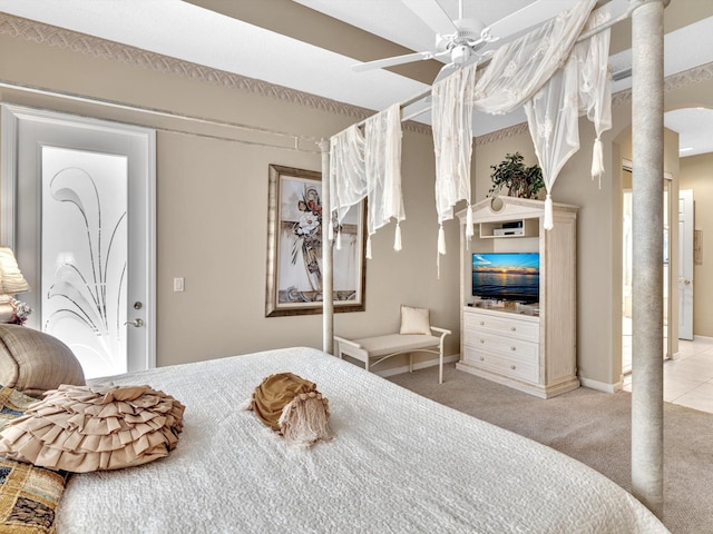 carpeted bedroom featuring a ceiling fan and baseboards