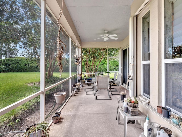 sunroom with a ceiling fan