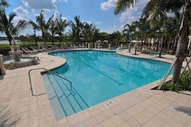 pool featuring a patio and fence