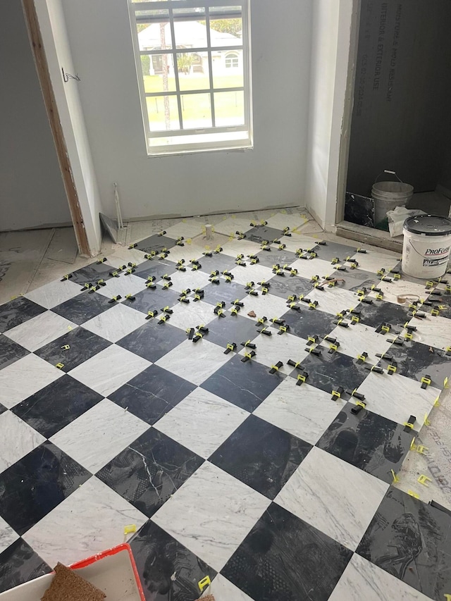 spare room featuring light tile patterned floors