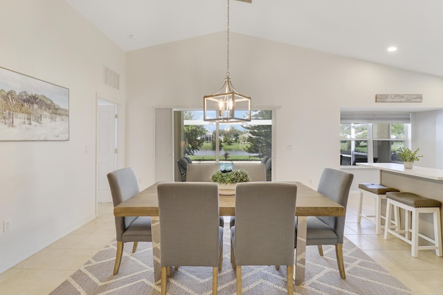 dining room with high vaulted ceiling, light tile patterned floors, visible vents, and a notable chandelier