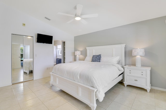 bedroom with lofted ceiling, ceiling fan, light tile patterned floors, and visible vents