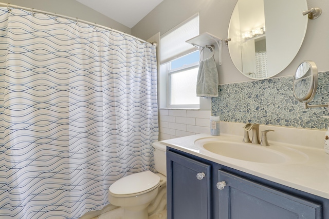 bathroom featuring toilet, a shower with shower curtain, tile walls, and vanity