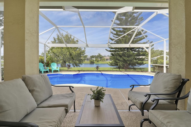 pool featuring an outdoor hangout area, a patio, a water view, and a lanai