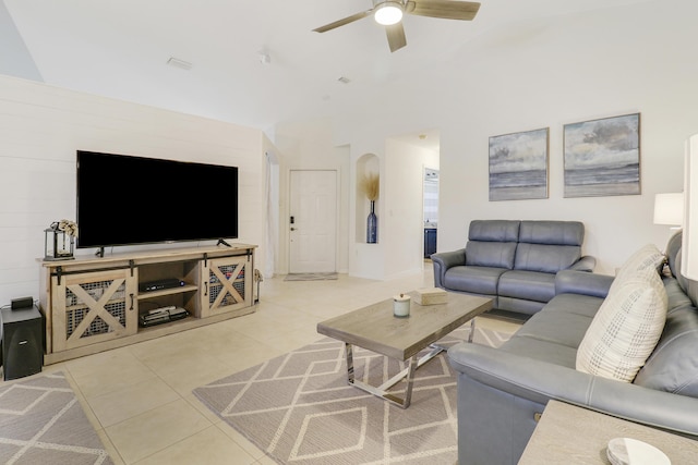 living room with ceiling fan and light tile patterned flooring