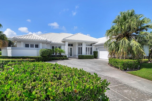 mediterranean / spanish house with a garage