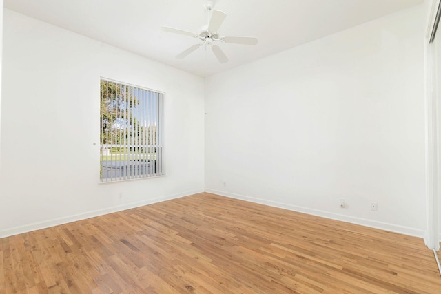 spare room featuring ceiling fan and light hardwood / wood-style flooring