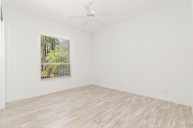 spare room featuring light wood-type flooring and ceiling fan