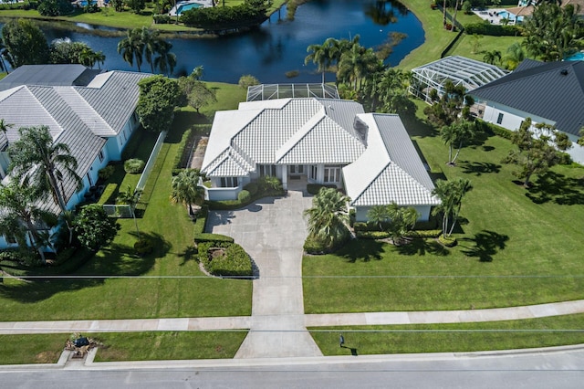 birds eye view of property with a water view