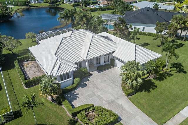 birds eye view of property with a water view