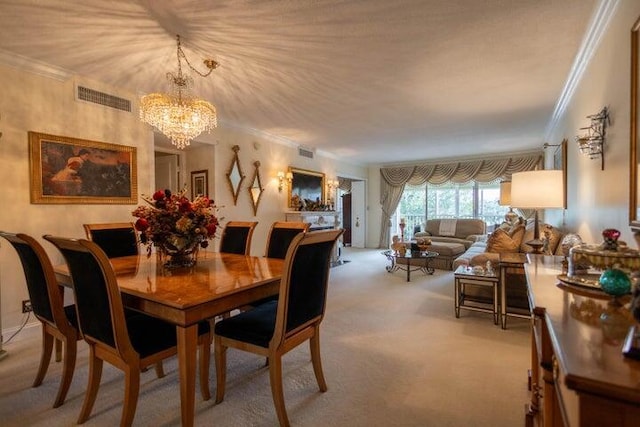 carpeted dining room with crown molding and a chandelier