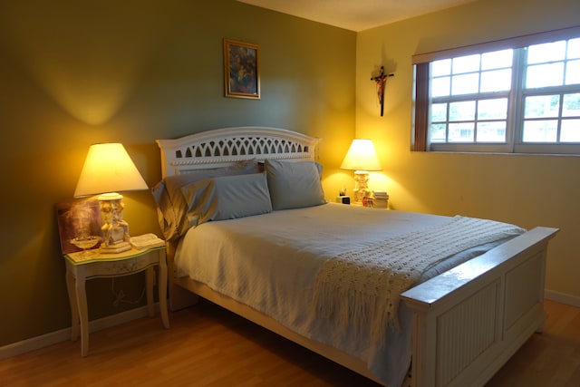 bedroom featuring hardwood / wood-style floors