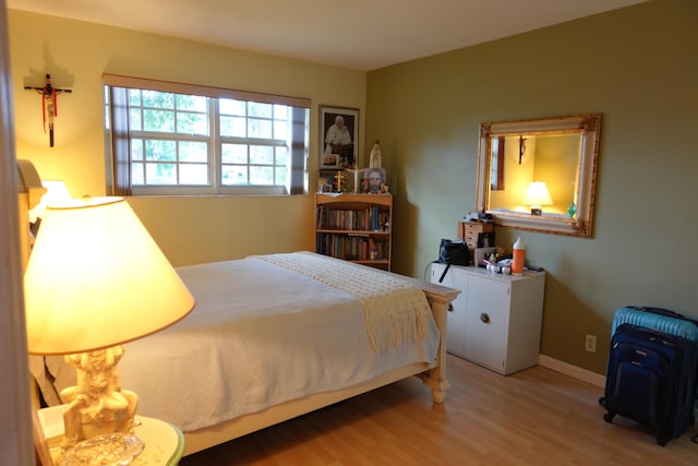 bedroom with wood-type flooring