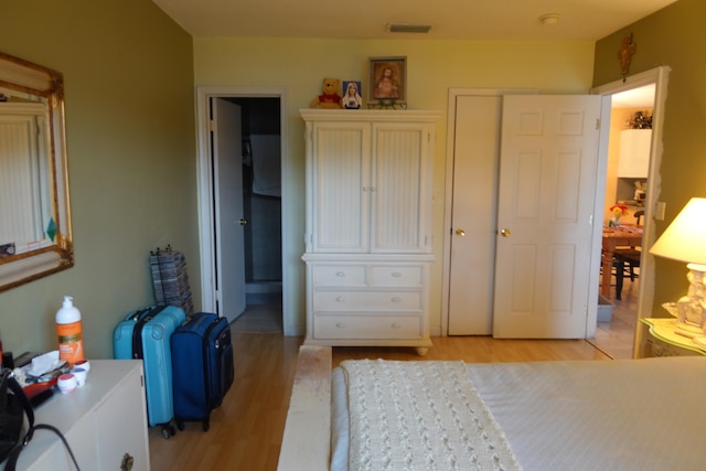 bedroom featuring light hardwood / wood-style floors and a closet