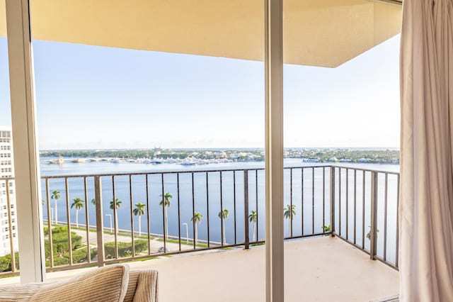 balcony featuring a water view