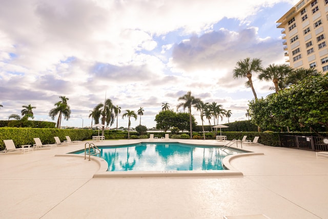 view of swimming pool featuring a patio area