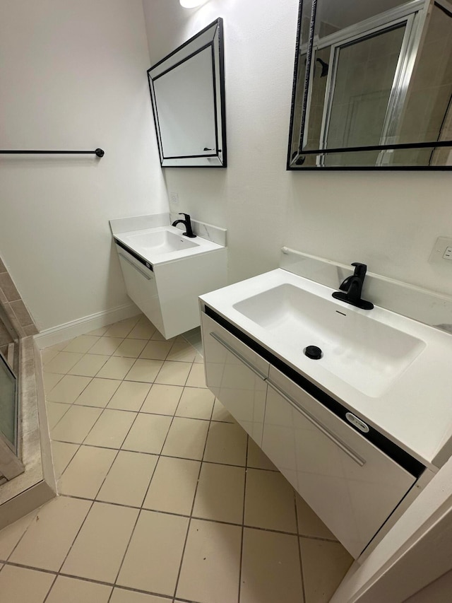 bathroom with walk in shower, tile patterned floors, and vanity