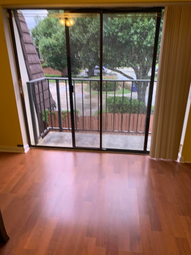 empty room featuring hardwood / wood-style flooring