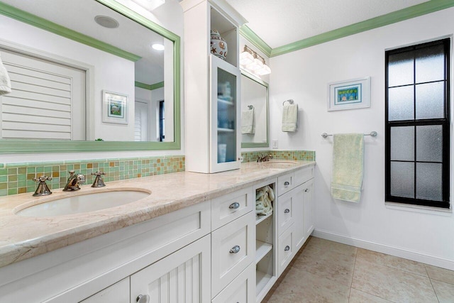 bathroom with a textured ceiling, tile patterned floors, vanity, tasteful backsplash, and ornamental molding