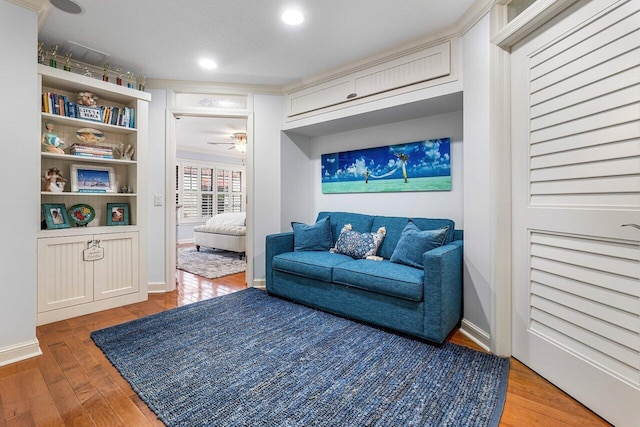 sitting room featuring ceiling fan and light hardwood / wood-style floors