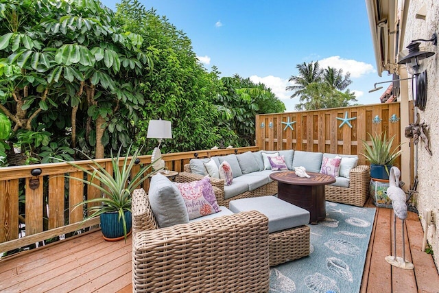 wooden terrace featuring an outdoor hangout area