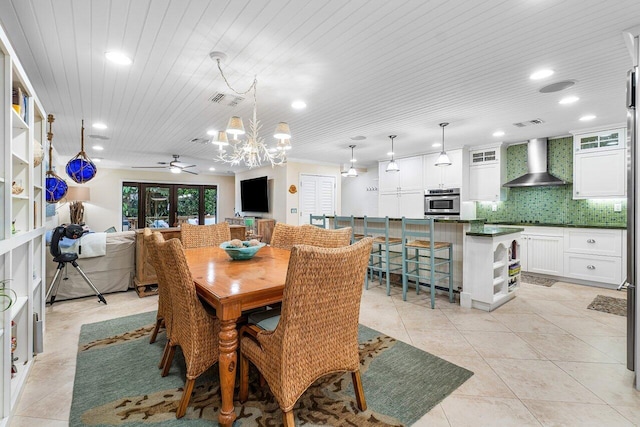 tiled dining space featuring wood ceiling, ceiling fan with notable chandelier, and french doors