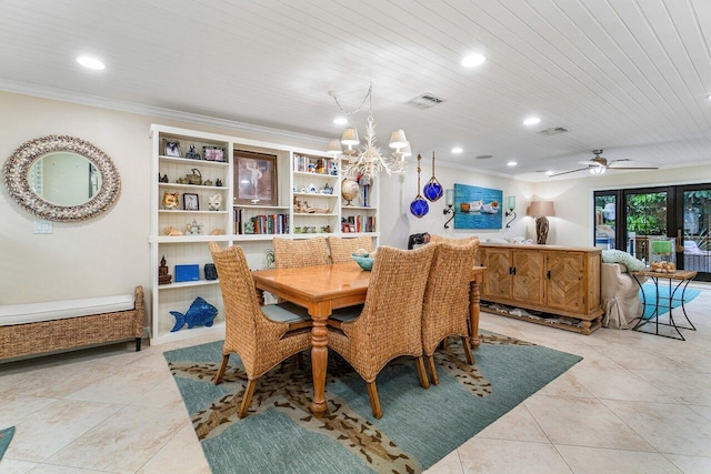 dining area featuring crown molding, ceiling fan with notable chandelier, and light tile patterned floors