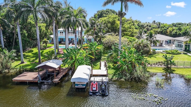 920 Hibiscus Ln, Delray Beach, FL 33444 - dock area with a yard, a water view, boat lift, and fence