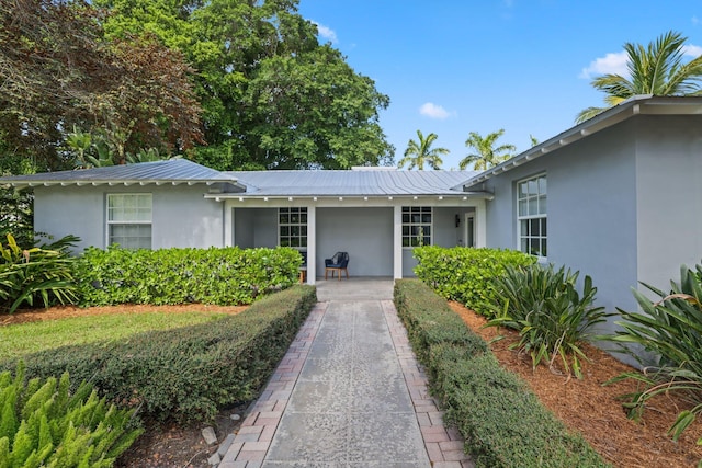 920 Hibiscus Ln, Delray Beach, FL 33444 - single story home featuring metal roof, a standing seam roof, and stucco siding