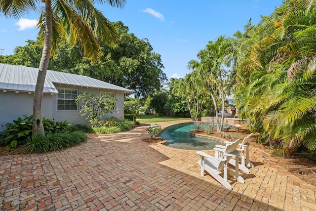 view of pool featuring a patio area