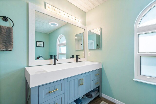 bathroom featuring vanity and hardwood / wood-style floors