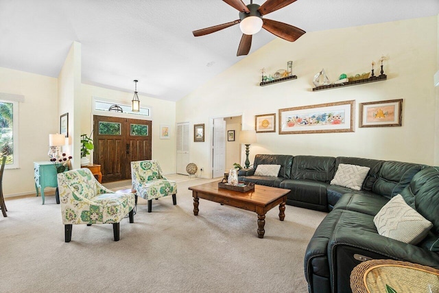 living room with light colored carpet, high vaulted ceiling, and ceiling fan