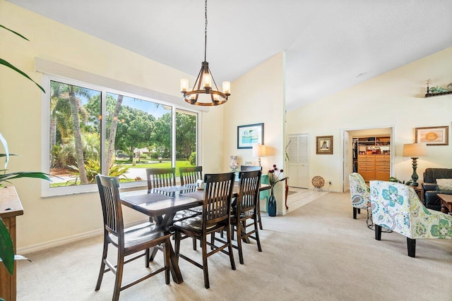 carpeted dining area featuring lofted ceiling and an inviting chandelier