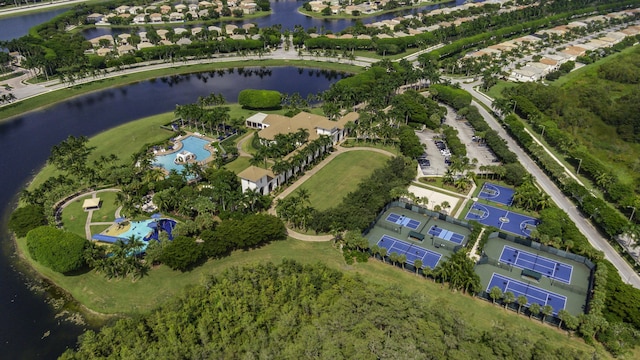 drone / aerial view with a water view and a residential view