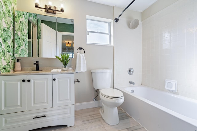 full bathroom featuring tiled shower / bath combo, vanity, wood-type flooring, and toilet