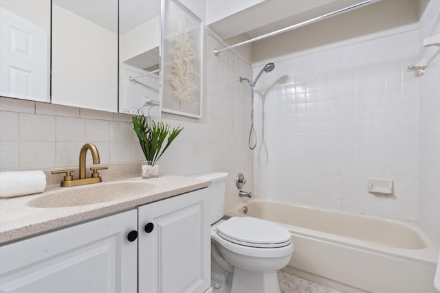 full bathroom with vanity, toilet, tiled shower / bath combo, and decorative backsplash