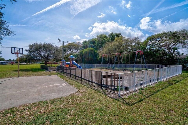 view of play area featuring a yard and basketball court