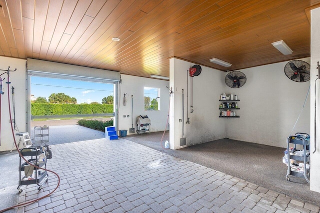 interior space featuring carpet floors and wood ceiling